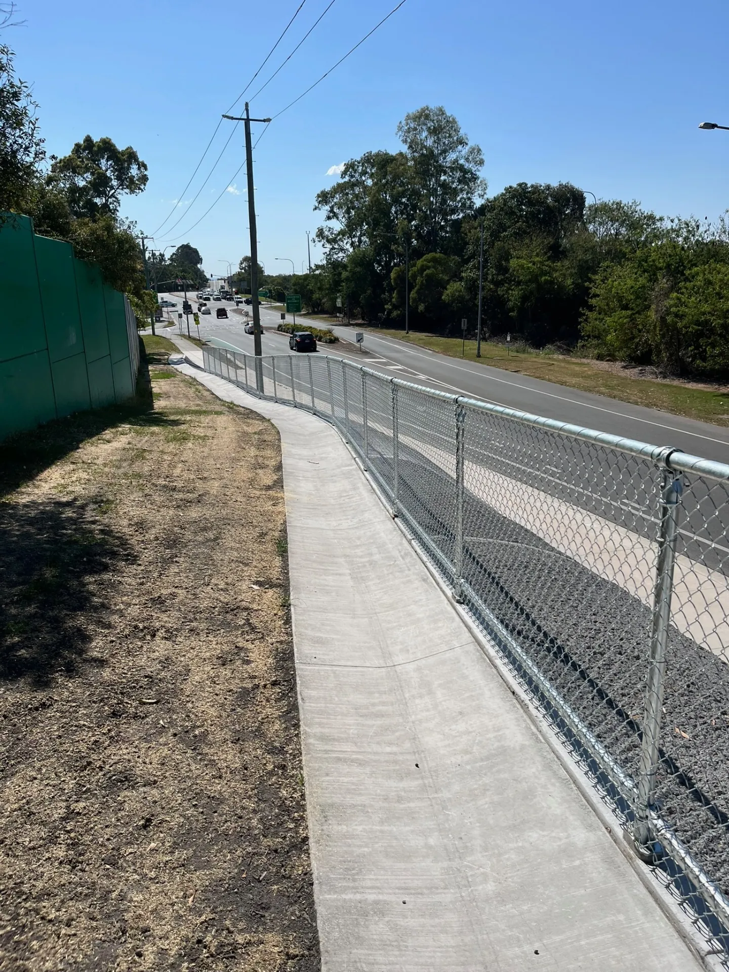 Fencing separating a public pathway from a roadway